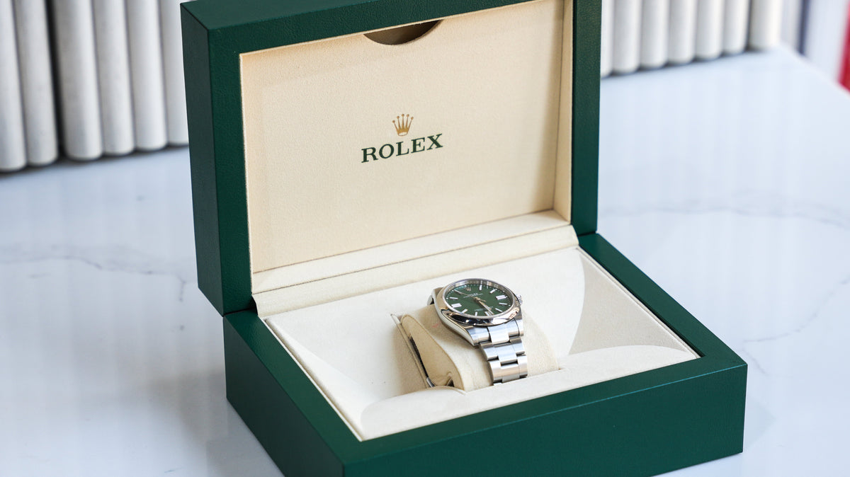 Pre-Owned Rolex Oyster Perpetual 124300-0005 â€“ Green Dial with Smooth Bezel and Stainless Steel Oyster Bracelet
