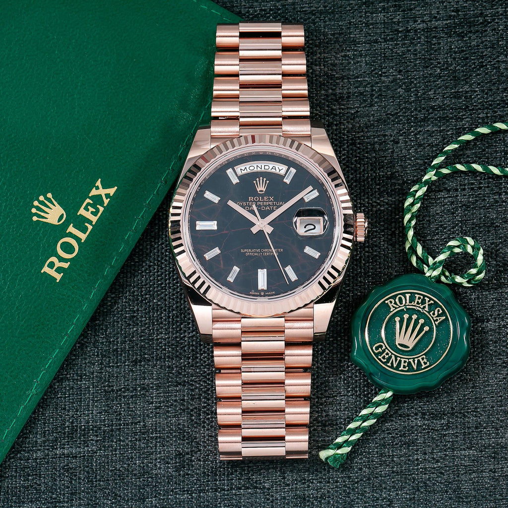 Pre-Owned Rolex Day-Date 40MM 228235 Black Baguette Diamond Dial Fluted Bezel 18K Rose Gold President Bracelet