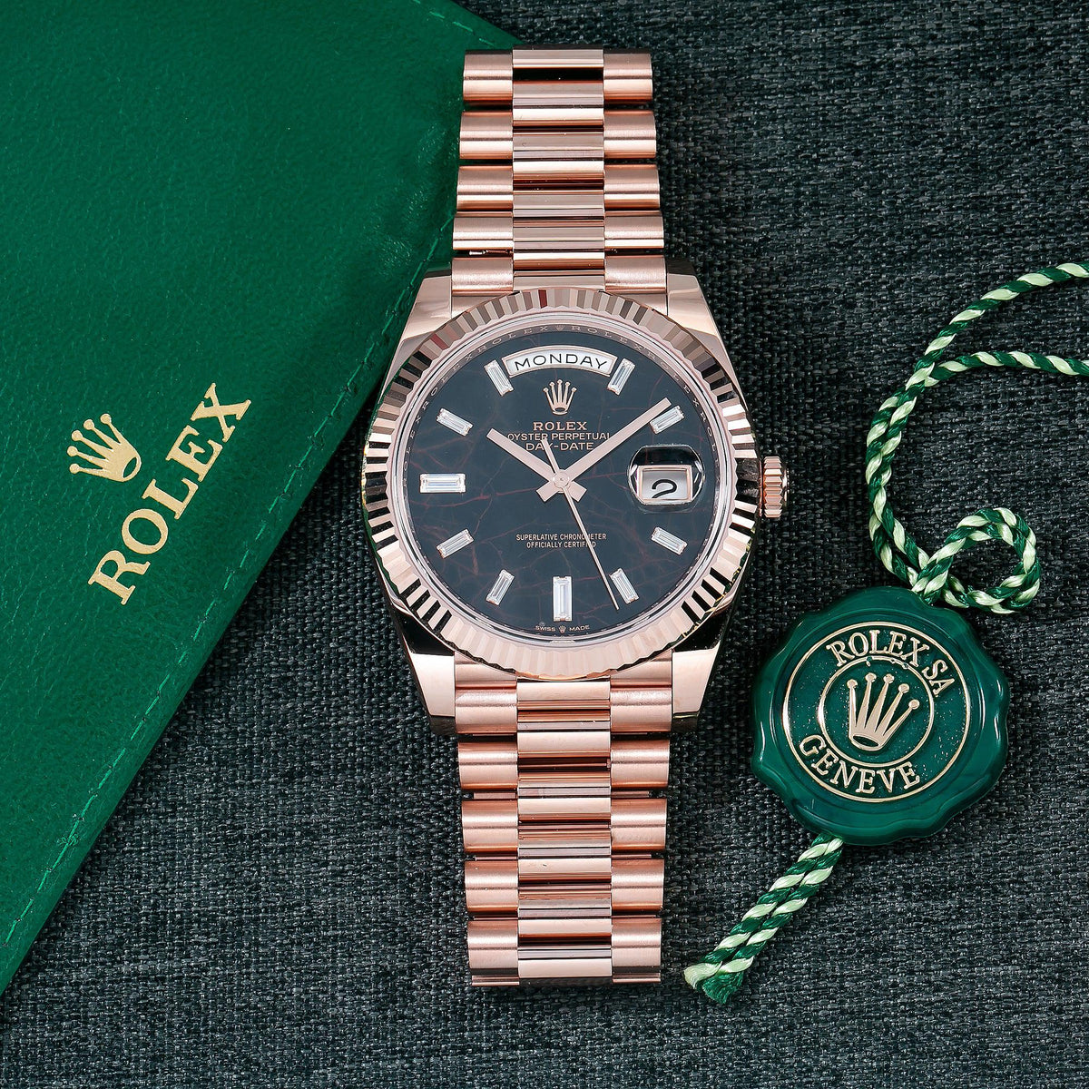 Pre-Owned Rolex Day-Date 40MM 228235 Black Baguette Diamond Dial Fluted Bezel 18K Rose Gold President Bracelet