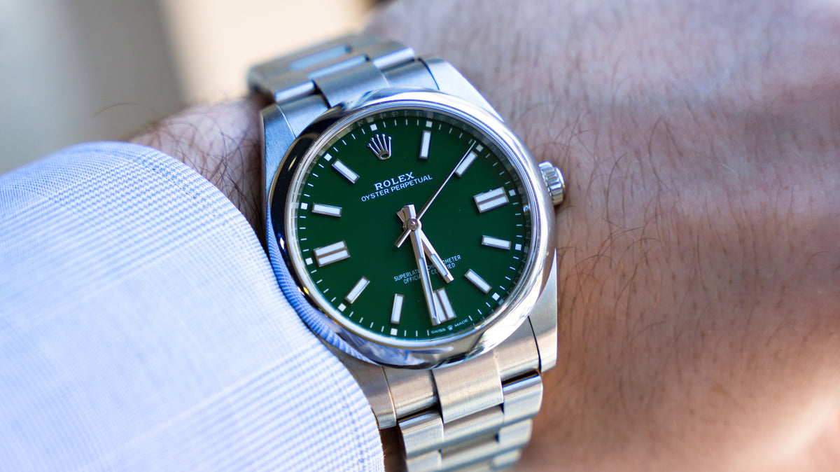 Pre-Owned Rolex Oyster Perpetual 124300-0005 â€“ Green Dial with Smooth Bezel and Stainless Steel Oyster Bracelet