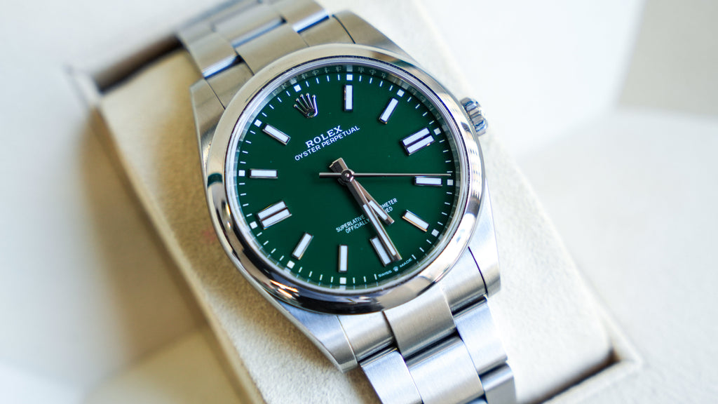 Pre-Owned Rolex Oyster Perpetual 124300-0005 â€“ Green Dial with Smooth Bezel and Stainless Steel Oyster Bracelet