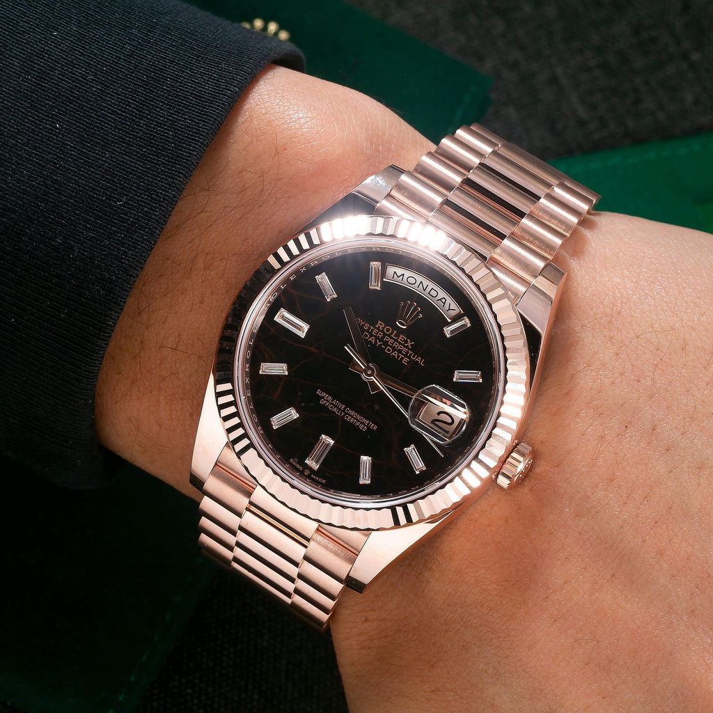 Pre-Owned Rolex Day-Date 40MM 228235 Black Baguette Diamond Dial Fluted Bezel 18K Rose Gold President Bracelet