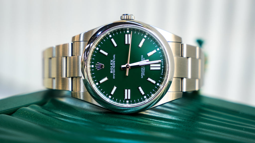 Pre-Owned Rolex Oyster Perpetual 124300-0005 â€“ Green Dial with Smooth Bezel and Stainless Steel Oyster Bracelet