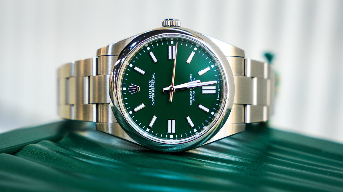 Pre-Owned Rolex Oyster Perpetual 124300-0005 â€“ Green Dial with Smooth Bezel and Stainless Steel Oyster Bracelet